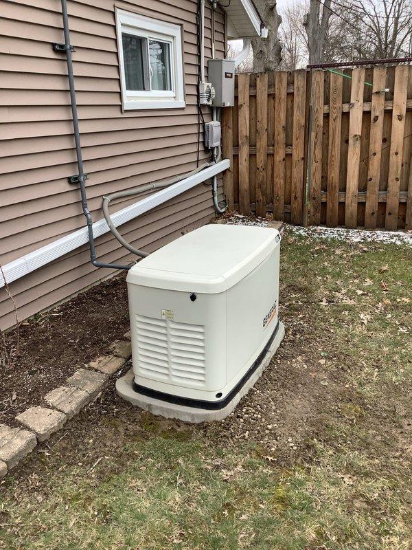 Performed annual maintenance service on residential Generac standby generator including replacement of oil pressure switch. All required parts were installed and system functionality verified. Generator is mounted on concrete pad with proper electrical connections to home's electrical panel.