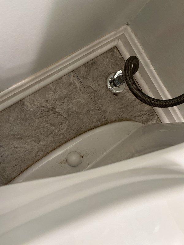 Installed new straight stops for hall bathroom toilet and master bathroom, requiring removal of toilet and unsoldering of existing stops. Replaced hall bathroom toilet components including fill valve, supply line, and flush valve gasket to address periodic leaking. Installed new 19.5-inch toilet in master bathroom with new supply lines for vanity. Updated kitchen dishwasher valve and supply line, and rebuilt corroded pipes below water meter to address leaking 1x3/4 elbow in basement.