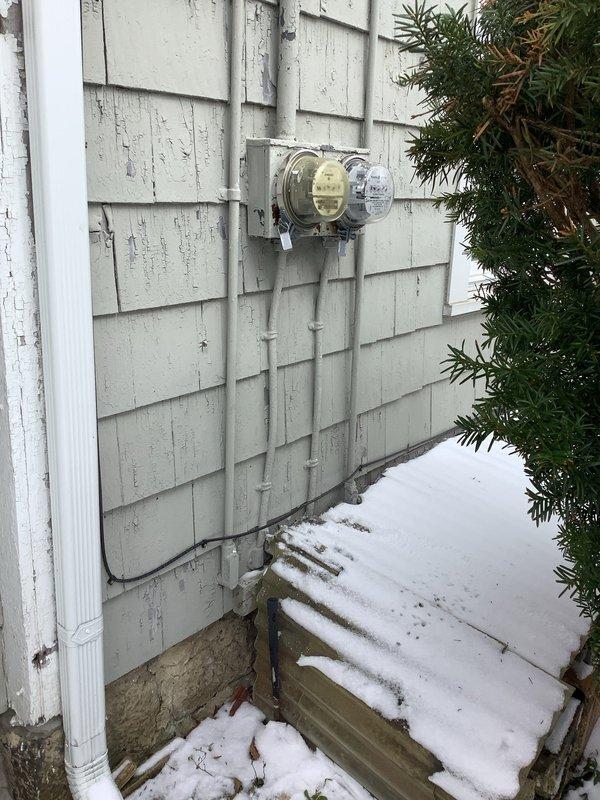 Diagnosed power loss affecting approximately 80% of lower apartment. Inspection revealed outdated electrical panels requiring replacement. Recommended installation of two new panels to restore full power distribution and installation of a new circuit to address the affected areas. Documented existing panel configuration and exterior meter connection for proper service restoration planning.