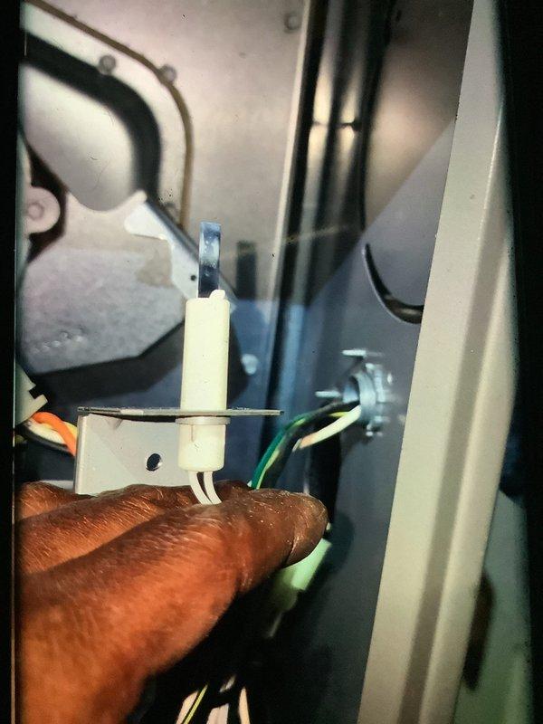 Performed routine MVP heating maintenance service, inspecting the blower wheel assembly for proper operation and dust accumulation. Examined the igniter/flame sensor component and verified all wiring connections were secure and in good condition. System is functioning within normal parameters.