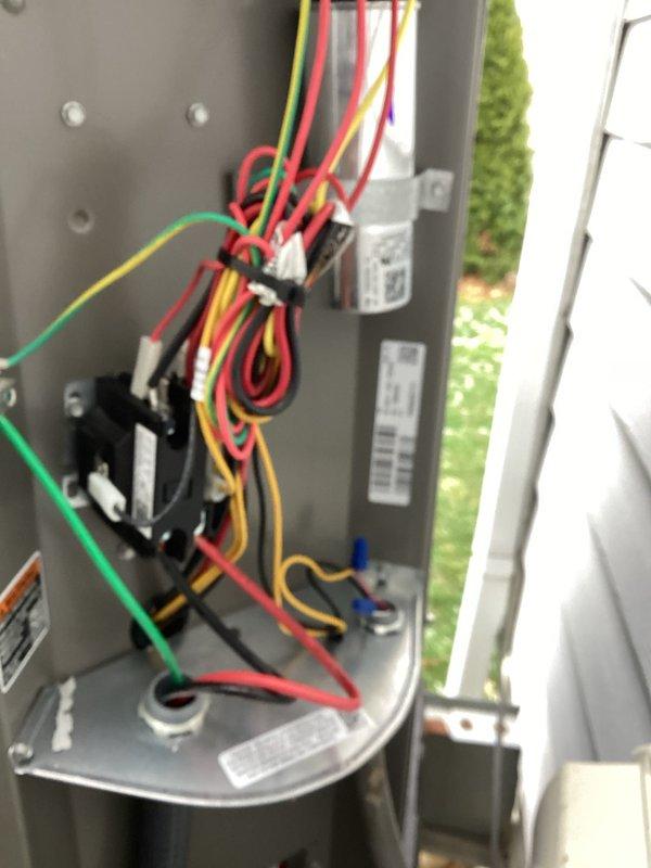 Performed routine maintenance service on customer's Lennox outdoor AC unit. Inspected electrical components and wiring connections, confirming all were properly secured and in good working condition. Advised customer that soft start capability was not available for this particular model.