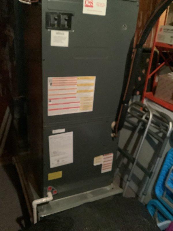 Conducted heat pump estimate, documenting existing furnace unit in utility area with appropriate ventilation connections and electrical components. Inspected exterior electrical service including meter setup and conduit connections. Noted current system configuration to prepare comprehensive replacement proposal.