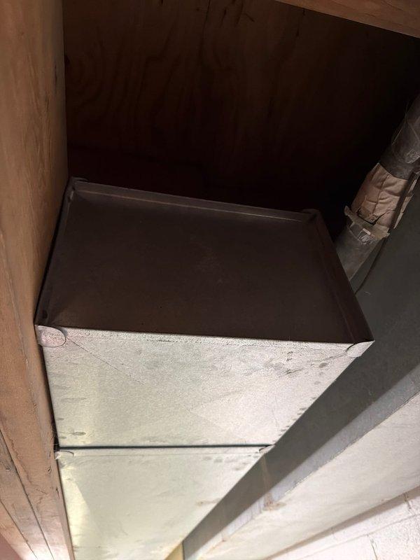 Responded to failed inspection regarding exterior seal at electrical conduit penetration to condenser unit. Documented condition with photos showing ceiling access panel installation and metal duct component within wooden enclosure. Work on hold pending manager approval.