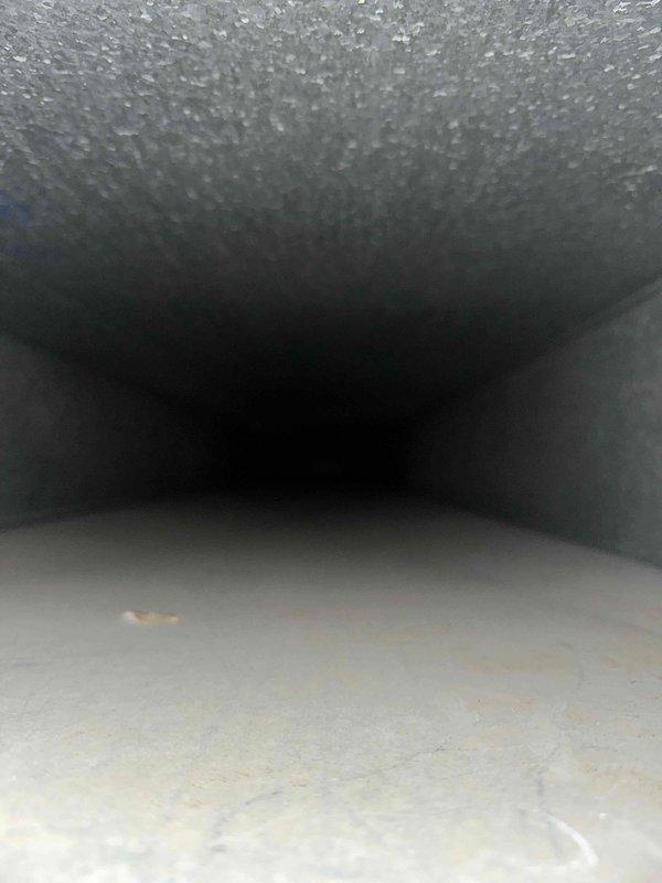 Completed comprehensive duct cleaning service on HVAC system with confirmed time window of 8-9am. Inspection revealed accumulation of dust and particulate matter on interior duct surfaces, with notable deposits on insulation lining. Thoroughly cleaned all accessible ductwork, removing contaminants to improve system efficiency and indoor air quality.