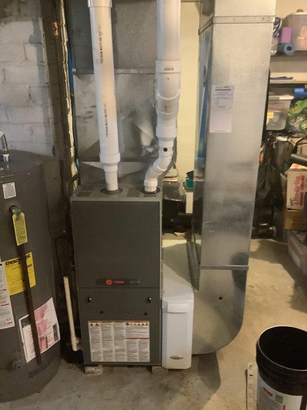 Successfully installed a 90% efficient Trane furnace with proper venting using PVC exhaust and intake piping. System includes a condensate pump to manage water discharge. All connections were verified and temperature differential testing was performed to confirm proper operation.
