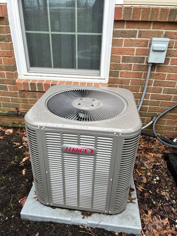Performed routine cooling maintenance on Lennox outdoor AC unit. Inspected fan motor and blower assembly for proper operation, cleaned unit exterior, and verified system is functioning correctly. All components in working order with no issues detected.