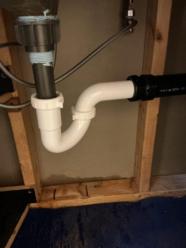 Successfully replaced two customer-supplied lavatory faucets with new angle stops in the hall bathroom and basement. Removed existing plumbing components and installed new tubular trap in the first-floor bathroom, while the basement lavatory required cutting off the PVC fitting and installing a new ABS trap adapter with appropriate connections.