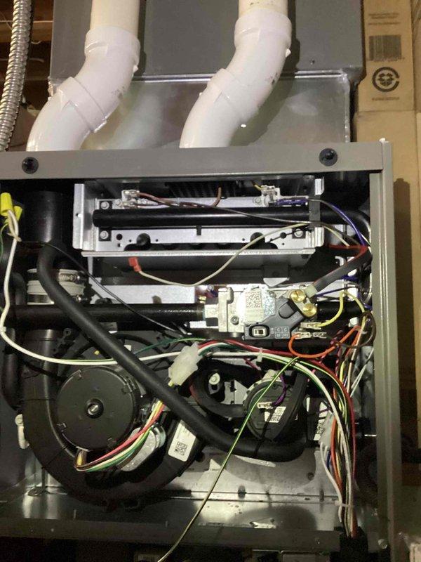 Performed scheduled BS-MVP heating maintenance service. Inspected furnace components including blower motor assembly, control boards, and electrical connections. Examined PVC intake/exhaust venting system and verified proper ductwork installation with secured joints.