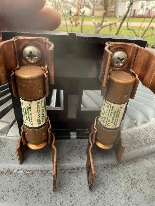 Performed comprehensive A/C tune-up service as part of promotional offer. Inspected electrical components including fuses and connections in outdoor condensing unit. Examined Carrier furnace system with attached ductwork and verified proper operation of all HVAC equipment in basement utility area.