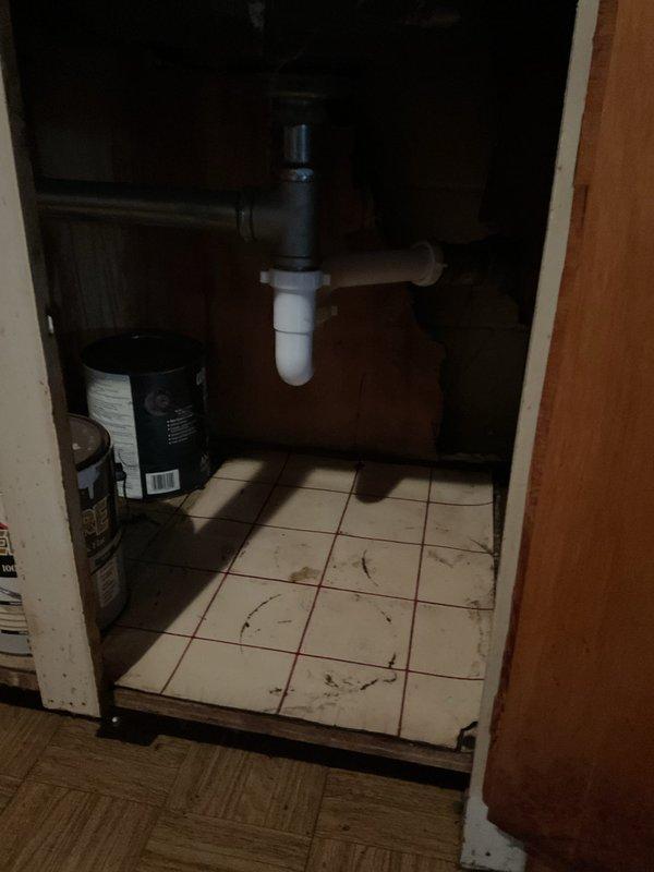 Successfully replaced the galvanized kitchen drain line with new PVC components, including installation of a sanitary tee and air admittance valve above the trap arm connection. Snaked kitchen drain from cabinet to basement lateral to clear blockage and ensure proper drainage. Completed full rebuild of drain system with proper connections and venting for optimal performance.