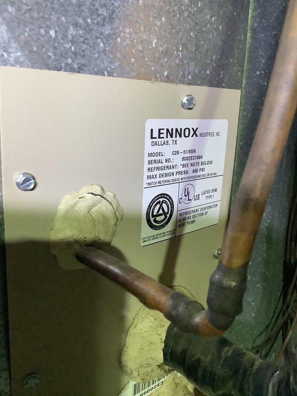 Performed annual preventative maintenance tune-up on a Lennox C28-51GEN heat pump system. Inspected refrigerant lines, connections, and verified system pressure remained within manufacturer specifications (maximum 450 PSI). Unit is properly installed on stone bed with adequate clearance for airflow, with electrical connections and refrigerant lines in good condition.