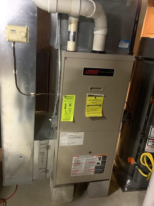 Completed BOGO promotion estimate for furnace and AC replacement. Inspected existing Lennox HVAC system including indoor furnace with PVC ventilation and outdoor condenser unit positioned on concrete pad with appropriate electrical connections. Documented current installation configuration for proper replacement planning.