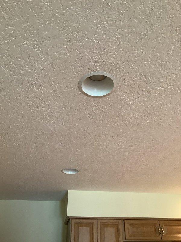 Responded to service call for non-operational recessed light fixture in kitchen ceiling. Diagnosed and replaced faulty 6-inch recessed light in 49-year-old home. Verified proper functionality of both kitchen ceiling fixtures after installation, confirming even illumination throughout the space.
