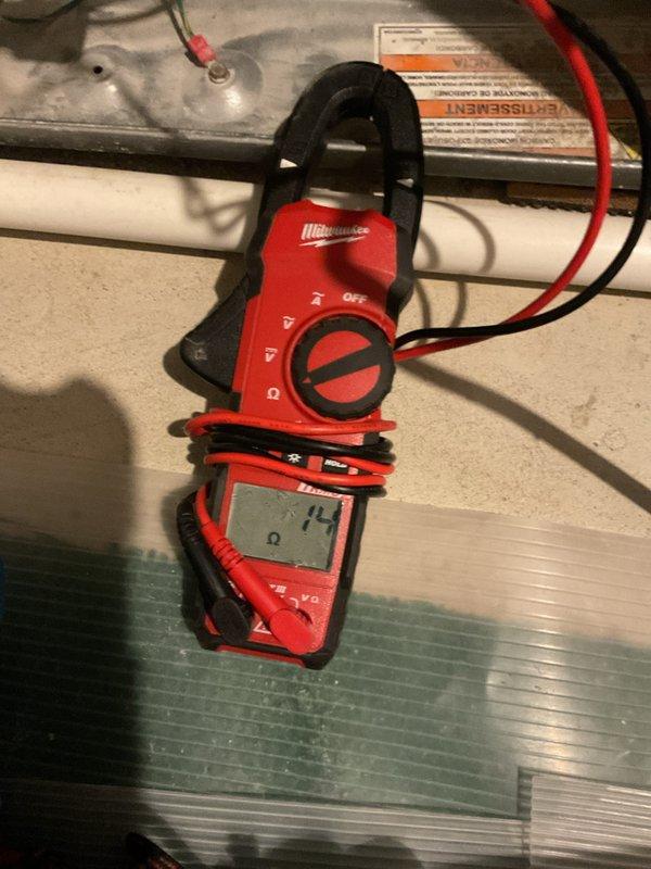 Completed MVP heating maintenance service. Inspected system components, noting some corrosion at pipe connection joint. Performed electrical testing with clamp meter showing 14 amp reading, confirming system is operating within normal parameters.