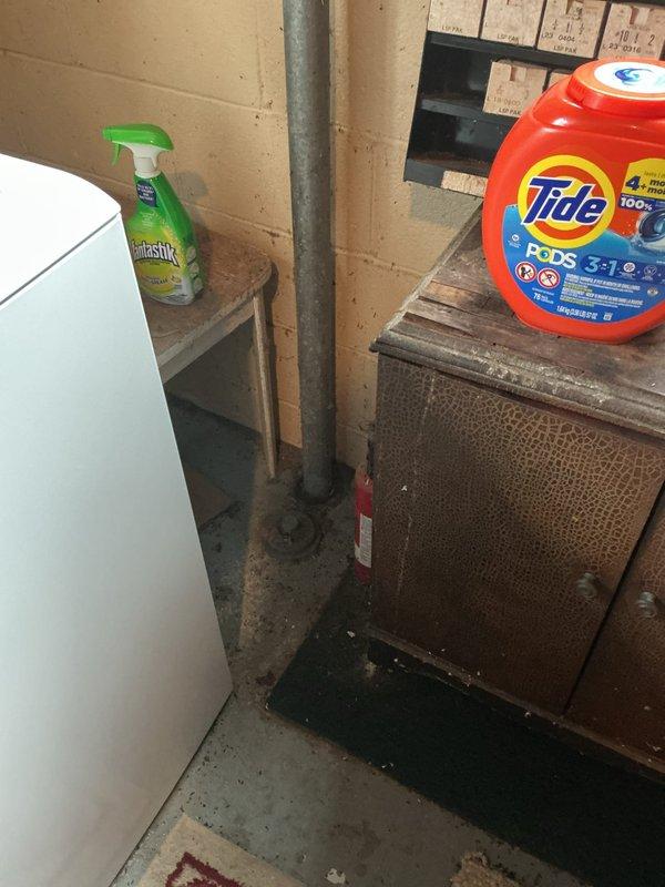 Responded to service call for clogged kitchen sink in 50-year-old home. Inspected drainage system in basement utility area, which revealed significant buildup in the main vertical waste stack. Successfully cleared obstruction using auger and restored proper drainage function throughout kitchen plumbing system.
