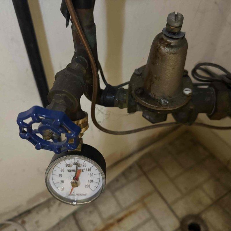 Performed scheduled MVP heating maintenance service at commercial site. Inspected boiler/hydronic system components including pressure gauge (reading 80-90 PSI), pressure regulator, and associated valves and piping. Examined furnace interior components including blower motor, gas valve assembly, control board, and wiring connections - all components functioning properly with no issues identified.