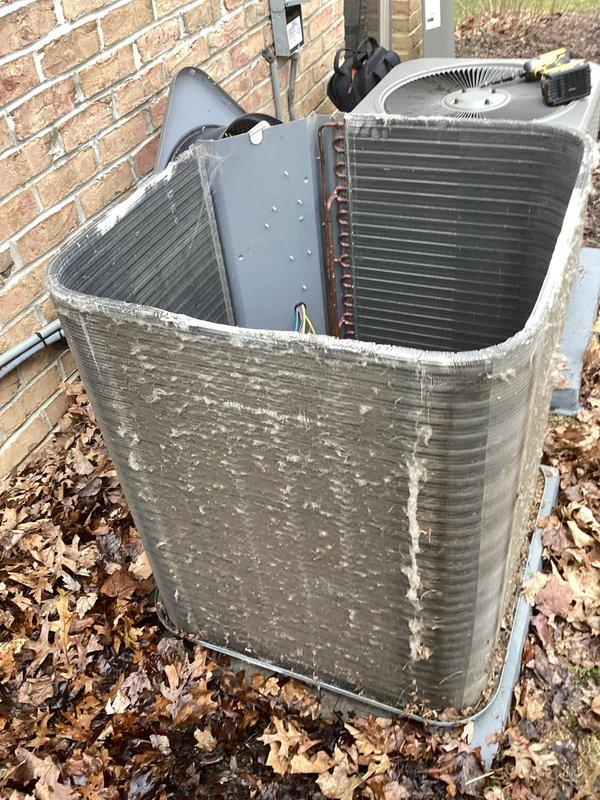 Performed scheduled maintenance on two heat pump systems, finding both outdoor condensing units with significant dirt accumulation on coils and cabinets. Removed access panels, thoroughly cleaned condenser coils to remove debris buildup and mineral deposits, cleared fallen leaves from around units, and inspected electrical connections and fan assemblies for proper operation to restore optimal heating efficiency.