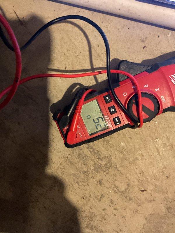 Performed annual maintenance on 11-year-old gas furnace. Inspected ignition system using hex key for adjustments and conducted electrical diagnostics with clamp meter showing 5.2 amp reading. System operating within normal parameters after service.