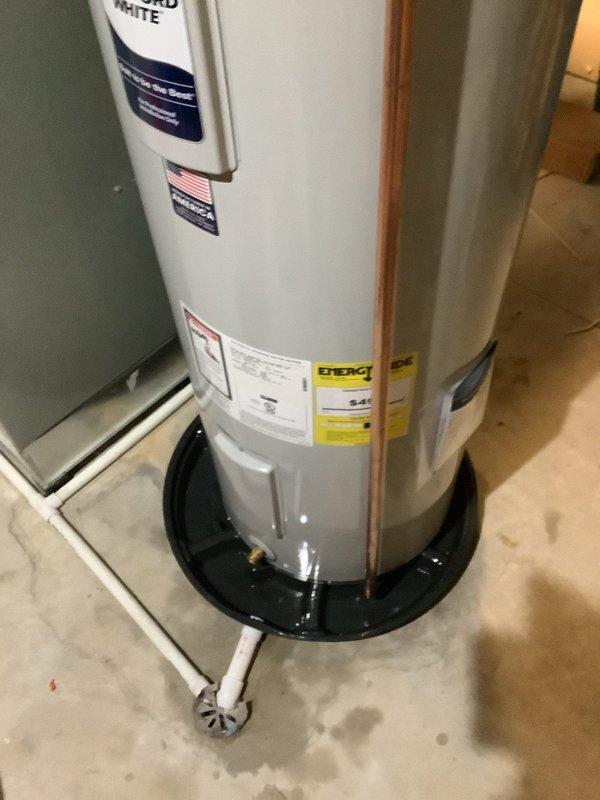 Successfully installed new 50-gallon electric tall water heater in utility area with proper connections to existing copper pipes. Installed unit on appropriate drain pan with PVC drain pipe connected to floor drain, and installed expansion tank as required. All connections were tested and verified for proper operation prior to completion.