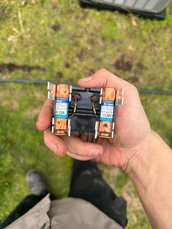 Successfully installed new 90k BTU air conditioning system, including inspection and replacement of electrical disconnect with proper 25A fuses and assessment of shut-off valves showing significant corrosion in the utility enclosure. Complete system installation verified with photographic documentation of all critical components.