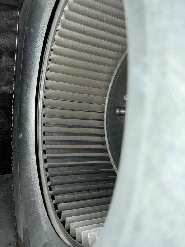 Performed AC tune-up with inspection of ductwork for potential cleaning requirements. Observed significant dust accumulation on blower wheel assembly and air filter showing substantial discoloration with uneven soiling patterns, indicating restricted airflow and reduced system efficiency.