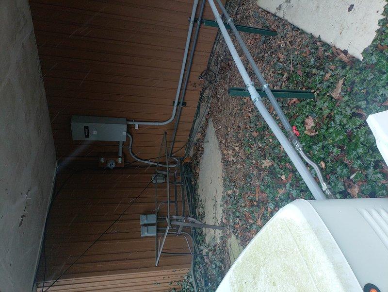 # Generator Service Summary

Performed scheduled maintenance on a 2-year-old 200-amp Generac standby generator system. Inspected and serviced the battery, verifying proper charge levels and connections. Checked all exterior components including electrical meter integration, conduit runs, and mounting hardware to ensure system integrity and code compliance.

# Detailed Service Report

Completed routine maintenance service on a residential 200-amp Generac automatic standby generator with approximately two years of operation. Upon arrival, conducted comprehensive visual inspection of the entire generator system and associated electrical infrastructure.

**Battery Service:** Inspected the generator's starting battery, which showed surface moisture consistent with normal condensation. Verified battery charge status using the integrated three-indicator system (red/manual, blue/negative, green/auto positions). Cleaned battery terminals and connections to ensure optimal electrical contact. The