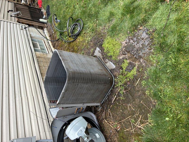 # Service Report

Completed comprehensive tune-up service on an 11-12 year old residential air conditioning system. Upon inspection, found condenser coils heavily clogged with dirt, debris, and organic matter significantly restricting airflow and reducing system efficiency. Performed thorough cleaning of condenser coils, removed accumulated buildup from fins, inspected refrigerant lines and electrical connections, and verified proper operation of all system components to restore unit to optimal performance specifications.