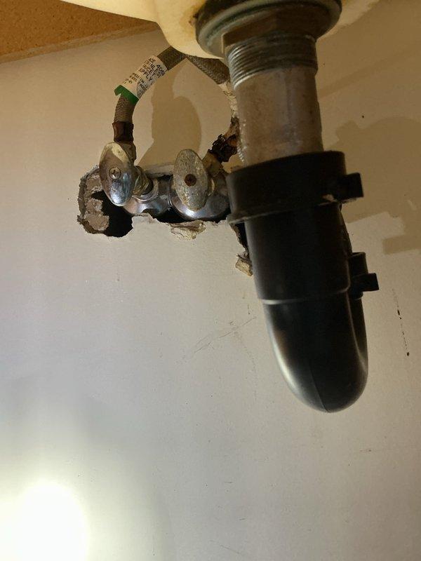 # Plumbing Service Report

## Summary
Replaced malfunctioning shower and bathroom sink faucets with customer-supplied fixtures, addressing leaks at control knobs and inconsistent temperature controls. Installed new shut-off valves and supply lines under bathroom sink to ensure proper water flow and prevent future leaks.

## Work Performed

Responded to service call for dual faucet issues in bathroom. Upon arrival, assessed shower faucet exhibiting leaks from behind control knob when not in use and inconsistent hot/cold water temperature regulation. Evaluated bathroom sink faucet showing active leaks from under knob during operation and suspected leaks beneath sink.

Removed existing shower faucet hardware and installed customer-provided replacement unit. Ensured proper sealing at wall plate connections to eliminate leakage behind control knob. Tested temperature control functionality and verified consistent hot/cold water delivery through mixing valve.

Proceeded to bathroom sink fauce