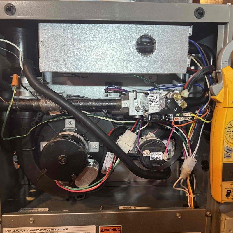 Performed routine maintenance on a 3-year-old gas furnace, including comprehensive system inspection and component verification. Accessed interior compartment to examine blower motor assembly, gas valve, control board, and electrical connections; all components found operating within normal parameters. Assessed ductwork condition and noted potential benefit from professional duct cleaning service.