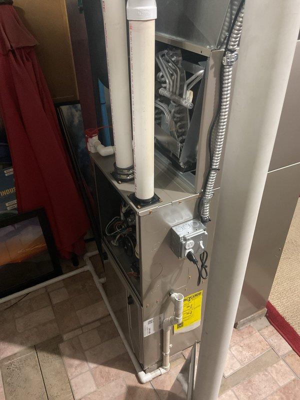 # Service Report

Completed comprehensive air conditioning tune-up on 3-year-old residential HVAC system per customer request. Performed full system inspection including visual examination of furnace unit, heat exchanger assembly, refrigerant lines, condensate drain lines, electrical connections, and ductwork connections. All components found to be in good working condition with normal operational wear; heat exchanger coils clean with no signs of corrosion or damage, PVC venting and drain lines properly secured and functioning, electrical junction box connections tight and secure. System tested and confirmed operating within manufacturer specifications.