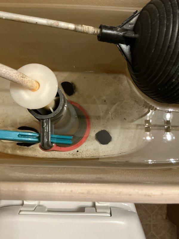 # Service Report: Toilet Water Discoloration Investigation

Responded to service call regarding yellow-colored water appearing in both toilets within a condominium unit. Upon arrival, conducted thorough inspection of toilet tanks and flushing mechanisms to diagnose the source of discoloration. Inspected internal tank components including float assembly, fill valve, flapper mechanism, and flush valve for signs of deterioration, rust, or sediment buildup that could cause water discoloration. Documented existing mineral deposits and sediment accumulation on tank floor and components. Performed flush cycle testing to observe water flow patterns and verify proper toilet operation. Determined discoloration was not originating from internal toilet components. Based on findings and the issue affecting multiple fixtures in the unit, advised customer that yellow water discoloration likely stems from building-wide plumbing system, potentially related to municipal water supply issues or aging galv