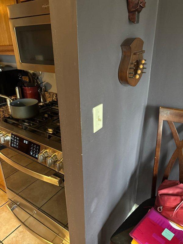 # Electrical Service Report

Responded to service call for multiple non-functioning outlets, light switches, and lighting fixtures throughout the residence. Performed comprehensive electrical troubleshooting to identify circuit issues affecting kitchen and hallway areas. Inspected and tested electrical outlets and switch assemblies, including dual-switch configuration in tiled hallway area and kitchen switch near cooking appliances. Verified proper circuit functionality, identified faulty connections, and restored power to all affected fixtures and receptacles. All switches and outlets tested operational upon completion of repairs.