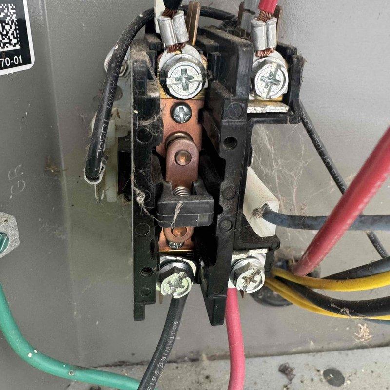 # HVAC Maintenance - Cooling Service Summary

Completed MVP Cooling Visit recurring maintenance service on air conditioning system. Performed comprehensive inspection of air handling unit and electrical components. Documented current condition of pleated air filter showing moderate dust accumulation and discoloration from normal operation, indicating filter is approaching replacement interval. Inspected electrical contactor assembly and verified proper wire connections on all terminals including power and control circuits. Observed minor copper contact oxidation consistent with normal wear. All electrical connections secure with appropriate wire management in place. System operational and functioning within normal parameters at time of service.