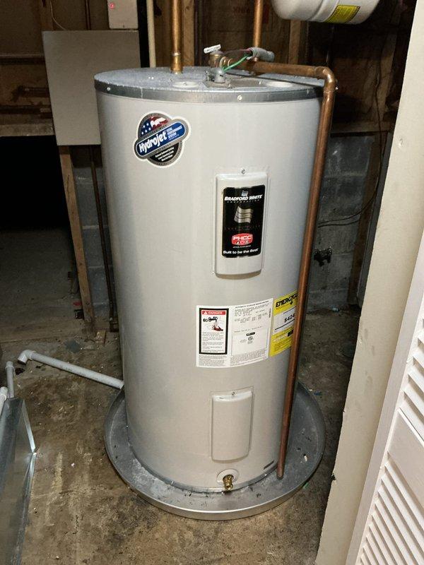 # Plumbing Service Completed

Responded to service call for multiple plumbing issues including intermittent upstairs shower drain clogging, inadequate hot water supply during showers, and cold water problems in the basement utility area. Upon inspection, assessed water heater condition and functionality in basement mechanical room, examining copper supply lines, pressure relief valve, and thermostat controls. Evaluated utility sink drainage system and inspected plumbing fixtures throughout the property to identify root causes of reported issues and determine appropriate corrective measures.