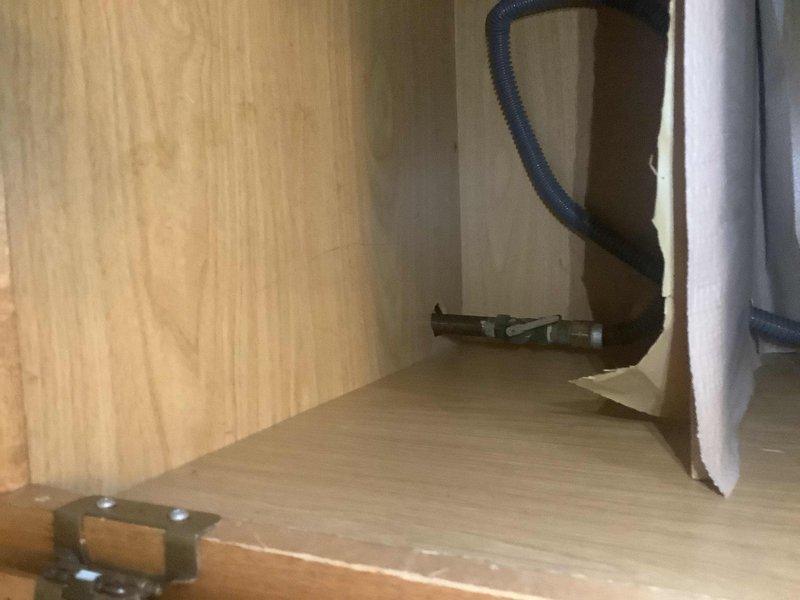 Responded to service call for gas valve assessment in preparation for new stove installation. Inspected existing gas line connection and shutoff valve within cabinet space, determining valve condition and compatibility with new appliance requirements. Completed evaluation and provided recommendations for valve replacement to ensure safe gas supply connection.