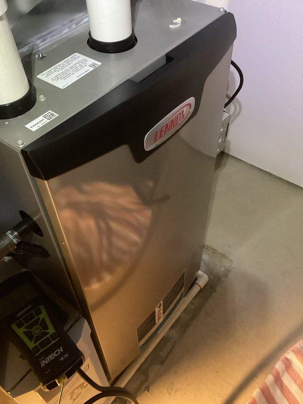 # HVAC Maintenance Visit - Dual System Service

Completed recurring maintenance visit on two HVAC systems with reported humidifier leakage issues. Performed comprehensive inspection of both heating units and identified severely clogged air filter as contributing factor to system inefficiency. The filter exhibited heavy dust and debris accumulation throughout lower two-thirds of mesh material, restricting proper airflow and potentially impacting overall system performance.

Inspected Lennox heating unit and associated components, verifying proper installation and operational status. Examined humidifier connections, drainage lines, and mounting hardware on both systems to identify source of reported leakage. Documented equipment conditions through photographic evidence showing filter contamination levels and overall system configuration. All manufacturer specifications labels and equipment identifiers were verified as present and legible for future service reference.

Addressed humidifie