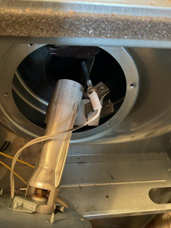 Responded to no-heat call on 9-year-old propane furnace. Upon arrival, found unit non-operational after homeowner attempted multiple restart cycles. Performed diagnostic inspection of blower assembly and burner components. Inspected humidifier drum and filter condition within cabinet. Identified moisture accumulation on blower housing and checked all electrical connections to motor and control board. Verified propane supply was adequate and examined ignition sequence operation. Documented equipment condition with photographs showing interior components including blower assembly, humidifier unit, and filter installation.