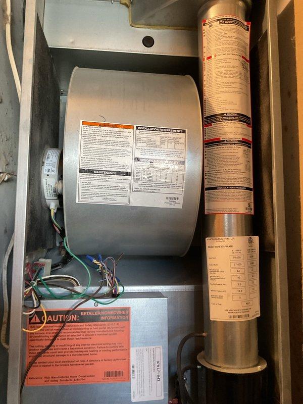 Responded to no-heat call on 9-year-old propane furnace. Upon arrival, found unit non-operational after homeowner attempted multiple restart cycles. Performed diagnostic inspection of blower assembly and burner components. Inspected humidifier drum and filter condition within cabinet. Identified moisture accumulation on blower housing and checked all electrical connections to motor and control board. Verified propane supply was adequate and examined ignition sequence operation. Documented equipment condition with photographs showing interior components including blower assembly, humidifier unit, and filter installation.