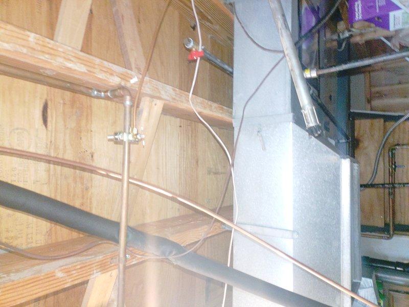 Installed two dedicated 110V electrical circuits to support HVAC and water heating systems. First circuit powers the furnace unit, while the second circuit serves the power vent assembly for the water heater. Routed electrical wiring through exposed wall studs and ceiling joists, securing all conduit and cabling per code requirements. All connections completed and circuits tested for proper operation.