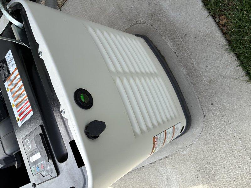 Performed routine maintenance on a 5-year-old 16KW Generac natural gas standby generator. Removed previous service company decals and applied new identification stickers to the unit. Inspected all accessible components including control panel, circuit breakers, ON/OFF switch, and status indicator lights, confirming proper operational condition of the generator system.