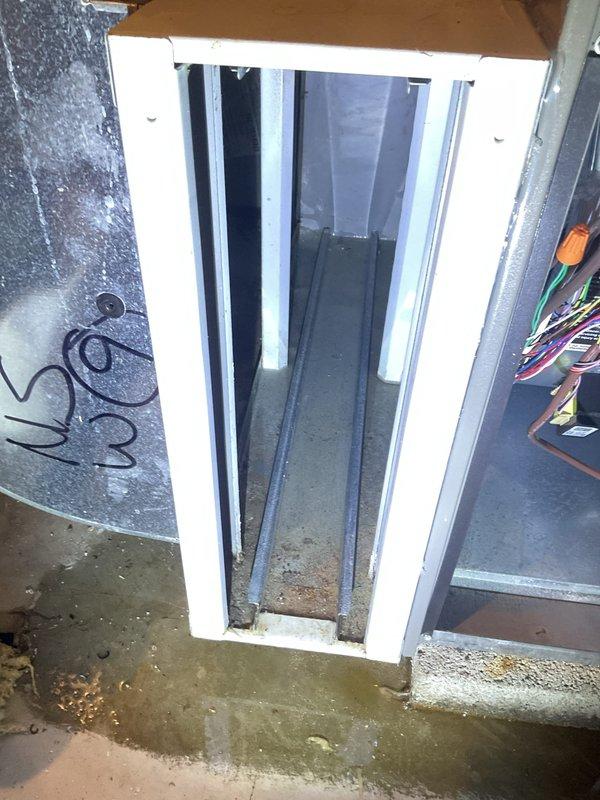 Responded to water leak in basement originating from HVAC humidifier system. Upon arrival, found significant water pooling on concrete floor near foundation window area and traced source to humidifier unit integrated with furnace system. Opened access panel on HVAC unit and inspected humidifier components, water supply line, and drain connections. Identified failed solenoid valve on humidifier water feed line causing continuous water flow and overflow condition. Replaced defective solenoid valve, tightened all water line connections, and verified proper drainage through humidifier drain line. Tested system operation through multiple heating cycles to confirm leak was resolved and no additional water discharge occurred. Documented existing moisture damage on basement floor and recommended monitoring area for proper drying. System restored to normal operation with no further water leakage detected.