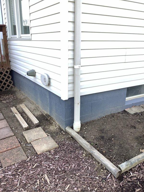 Provided quote for electrical installation to supply power from main residence basement to detached outbuilding. Assessed exterior routing path along foundation and evaluated interior basement conditions where service originates. Coordinated site visit with plumbing contractor for concurrent work scheduling. Documented existing conditions including foundation access points, exterior siding penetration locations, and interior framing at outbuilding structure currently under construction with exposed studs and building wrap installed.