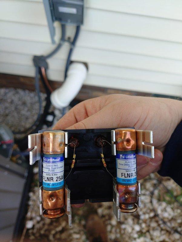 Completed installation of new Lennox air conditioning system with matching evaporator coil in basement mechanical room. Installed new 25-amp FLNR fuses in outdoor disconnect box to provide proper electrical protection for the condensing unit. Verified all ductwork connections to plenum, tested system operation, and confirmed proper refrigerant charge and airflow throughout the system.