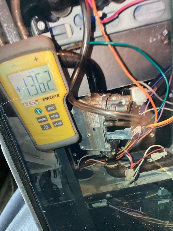Completed recurring maintenance visit on heating system. Performed diagnostic testing using digital multimeter, recording temperature reading of 135.7°F and inspecting electrical components including wiring connections, capacitor, and relay terminals. Identified need for dryer vent hose replacement on rear of dryer unit and additional dryer vent system repairs. Removed float switch assembly from unit for inspection. All heating system electrical connections verified secure and operational.