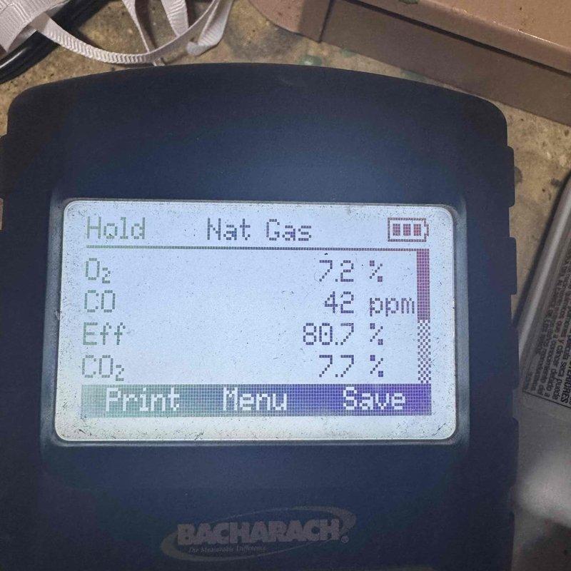 Completed comprehensive tune-up on 5-year-old air conditioning system. Performed combustion analysis on heating components, recording oxygen levels at 7.2%, carbon monoxide at 42 ppm, efficiency at 80.7%, and carbon dioxide at 7.7% using calibrated gas analyzer. Inspected control wiring and electrical connections in air handler compartment, verified all wire terminations secure, and cleaned accumulated dust and debris from equipment surfaces and components to ensure optimal system operation.