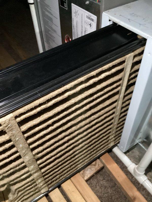 Completed MVP maintenance heating visit on residential HVAC system. Performed comprehensive inspection of furnace components including blower motor assembly, electrical connections, and internal wiring. Filter showed significant dust and debris accumulation on ridged slats and was heavily soiled throughout, requiring replacement to maintain proper airflow and system efficiency. Inspected blower motor housing, verified all electrical connections were secure, and confirmed proper wire routing through equipment. All mechanical components operating within normal parameters upon completion of maintenance service.