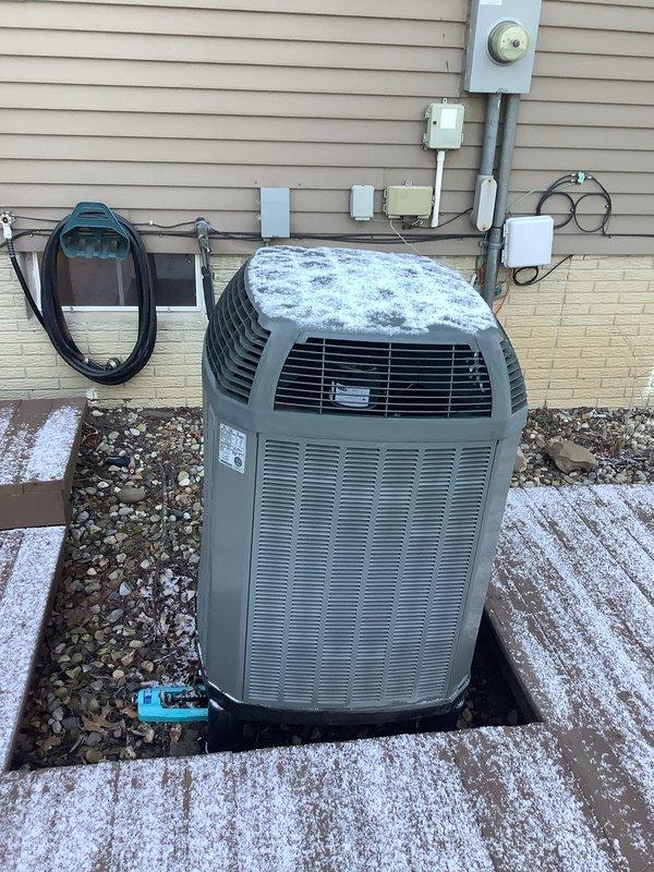 # HVAC System Conversion and Installation

Successfully completed a comprehensive system conversion from electric to natural gas heating, including installation of a complete HVAC system with all necessary components and infrastructure.

Installed a new 90% AFUE gas furnace as the primary heating unit, replacing the existing electric heating system. The furnace was properly positioned in the basement utility area with appropriate clearances and mounted securely. Connected high-efficiency PVC venting system, routing condensate drainage and exhaust piping through the ceiling structure to exterior termination points in compliance with manufacturer specifications and local code requirements.

Installed a new air conditioning condenser unit on the exterior of the residence, positioning it on a vibration-dampening rubber pad in the landscaped area adjacent to the home. Completed all electrical connections including dedicated circuit wiring, disconnect box, and proper grounding. Ran refrigera