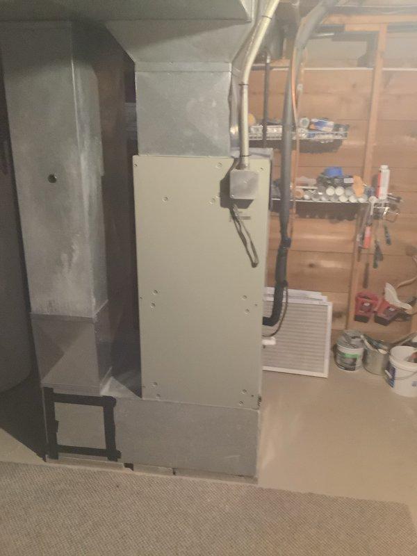 # HVAC System Conversion and Installation

Successfully completed a comprehensive system conversion from electric to natural gas heating, including installation of a complete HVAC system with all necessary components and infrastructure.

Installed a new 90% AFUE gas furnace as the primary heating unit, replacing the existing electric heating system. The furnace was properly positioned in the basement utility area with appropriate clearances and mounted securely. Connected high-efficiency PVC venting system, routing condensate drainage and exhaust piping through the ceiling structure to exterior termination points in compliance with manufacturer specifications and local code requirements.

Installed a new air conditioning condenser unit on the exterior of the residence, positioning it on a vibration-dampening rubber pad in the landscaped area adjacent to the home. Completed all electrical connections including dedicated circuit wiring, disconnect box, and proper grounding. Ran refrigera
