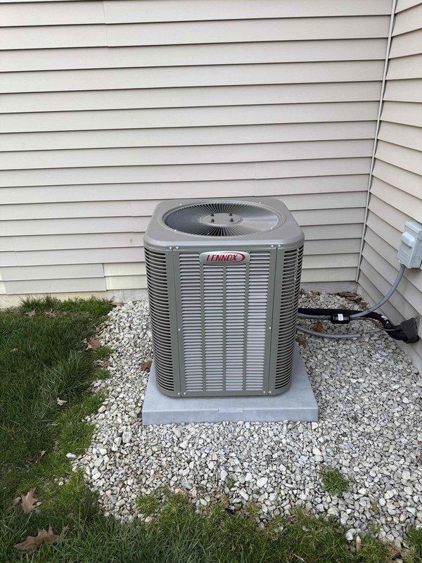Completed comprehensive maintenance visit on Lennox outdoor condensing unit. Performed standard preventive maintenance protocol including inspection of condenser coil, which showed moderate accumulation of dirt and debris between fins. Unit is properly installed on concrete pad with gravel drainage bed, all electrical and refrigerant lines secure and in good condition. System operational and ready for cooling season.