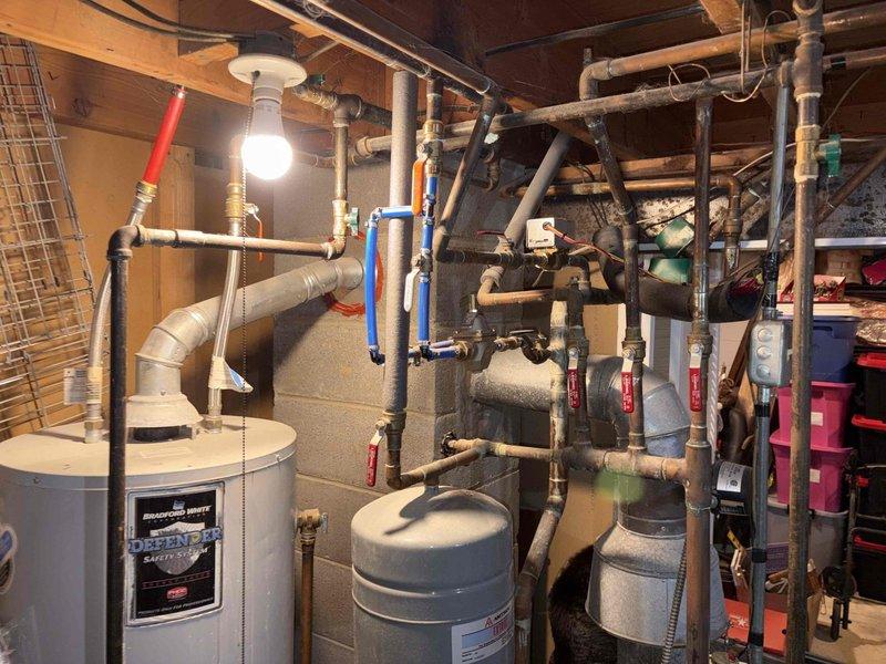 Conducted comprehensive estimate for Navien combi boiler replacement, including assessment of existing water heater and heating system with complex piping network, expansion tanks, and multiple shut-off valves. Evaluated electrical panel upgrade requirements for new boiler installation and provided additional estimate for standby generator system. Documented existing equipment configuration and utility space layout to develop accurate proposal for requested upgrades.